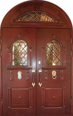 Стальная арочная дверь со стеклом и ковкой ДА-30 в дом из кирпича в Гатчине